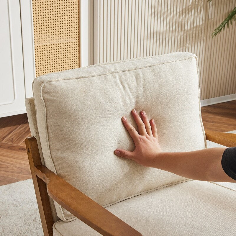Poltrona d'accento rivestita in misto lino con gambe in legno e un cuscino, beige