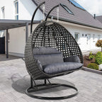 LeisureMod Sedia a Uovo Sospesa per 2 Persone con Supporto - Dondolo Pensile per Esterni/Interni in Rattan Intrecciato con Cuscini