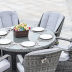 Set da pranzo rotondo da esterno in 7 pezzi in vimini di rattan con cuscini di Moda Furnishings