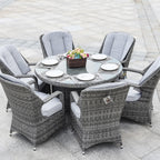 Set da pranzo rotondo da esterno in 7 pezzi in vimini di rattan con cuscini di Moda Furnishings