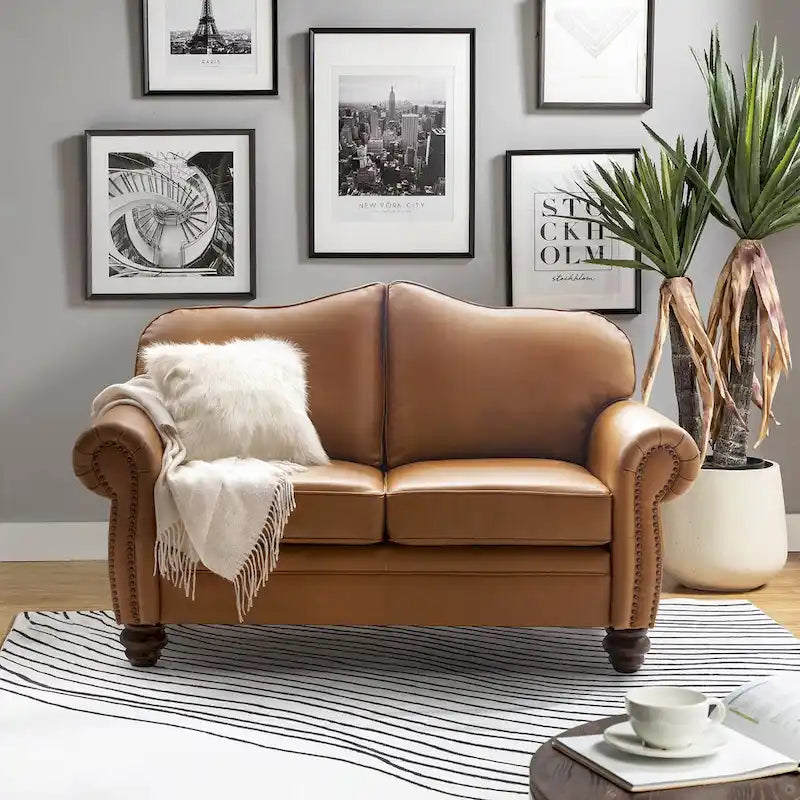 Divano transizionale in vera pelle con schienale trapuntato